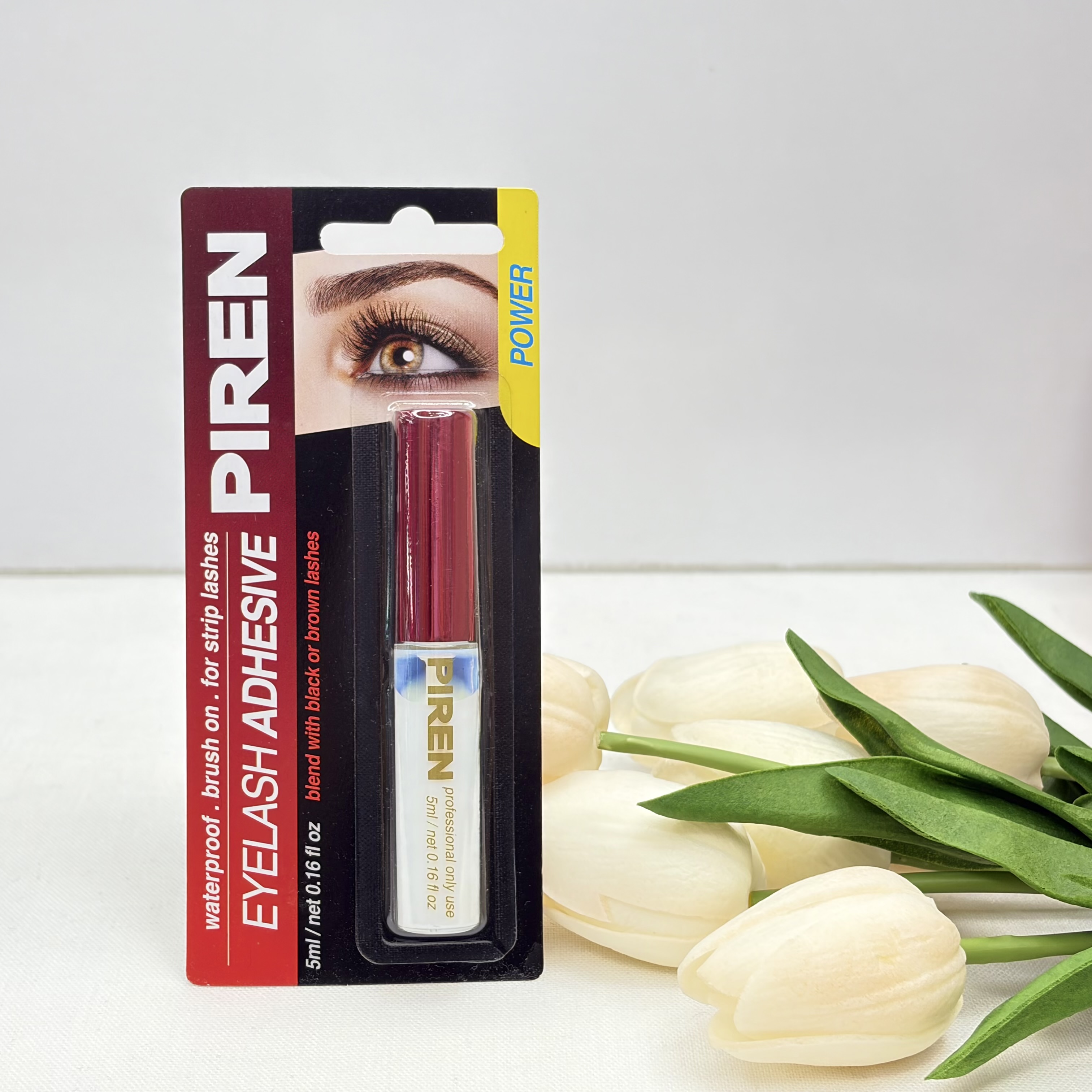 چسب مژه مصنوعیPIREN مدل Power با چسبندگی بالا، ضد آب، سریع خشک‌شونده، دارای فرچه برای استفاده آسان، رنگ شیری که پس از خشک شدن بی‌رنگ می‌شود، وزن 5 گرم